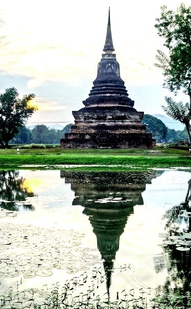 Chedi reflections in Sukhotai Historical Park / Thailand